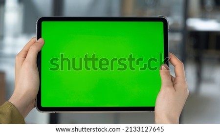 Digital tablet with green chroma key screen	