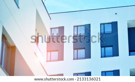 Fragment of modern residential apartment with flat buildings exterior. Detail of new luxury house and home complex.  Velvia photo filter.