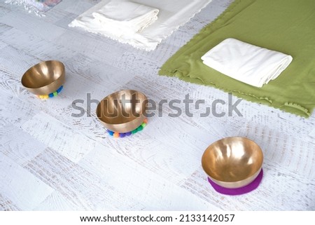 Sound healing therapy, singing bowl or sound bowl on wooden backdrop Royalty-Free Stock Photo #2133142057
