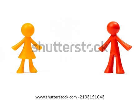 Figurines of separate father and mother in young family. Parents at a distance concept isolated on a white background