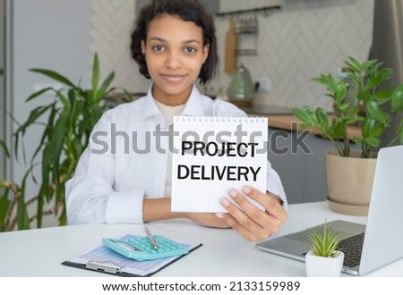 Business woman hand holding show blank paper sheet mock up empty white board space for shouting text rule or protest word. Text PROJECT DELIVERY