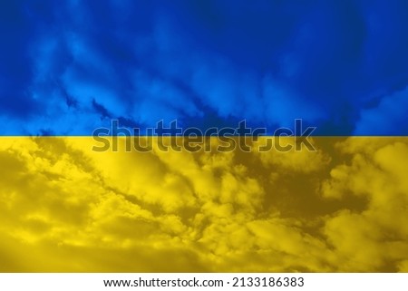 national flag of Ukraine, creative flag on background yellow, blue sky with clouds, concept of politics, global business, trading, international cooperation, basis for designer