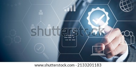 Certification Assurance Guarantee, ISO certification and standardization concept. Business process control optimisation industrial technology and workflow. Person touching certificate icons. Royalty-Free Stock Photo #2133201183