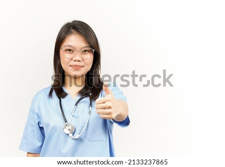 Showing Thumbs Up Of Asian Young Doctor Isolated On White Background
