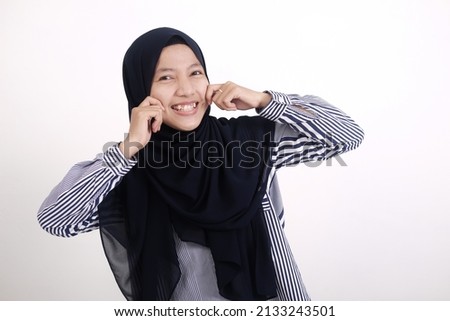 Asian Muslim woman smiling with passionate gesture, isolated photo on white background