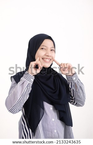 Indonesian hijabi woman smiling with passionate gesture, isolated photo on white background