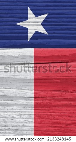 Texas state flag on dry wooden surface. Mobile phone wallpaper made of old wood. Vertical bright background. The symbol of one of the American states. Lone Star Flag