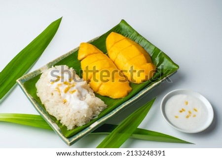 Mango Sticky Rice with coconut cream sauce isolate on a white background Royalty-Free Stock Photo #2133248391