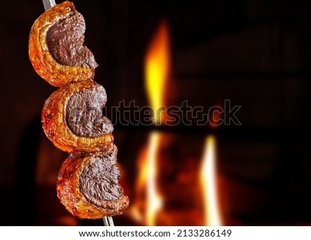 Steak rotisserie at the steakhouse, sliced picanha Royalty-Free Stock Photo #2133286149