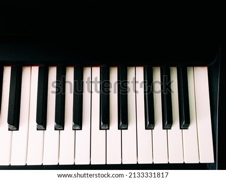 piano keys close-up, film grain and image blurriness