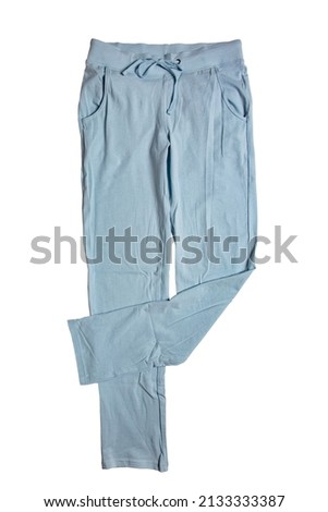 Sweat pants isolated. Close-up of womans fashionable blue casual trousers or jersey trousers isolated on a white background. Jogging outfit for workout. Clipping path.