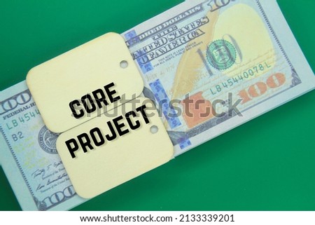 banknotes and wooden tags with the words core project
