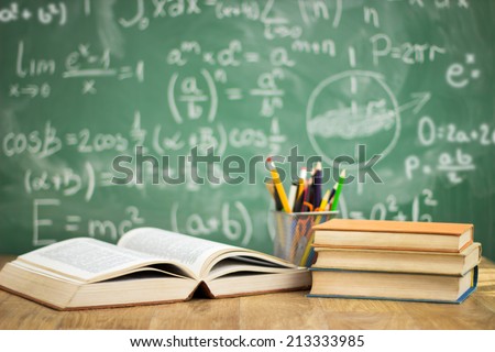 School books on desk, education concept Royalty-Free Stock Photo #213333985