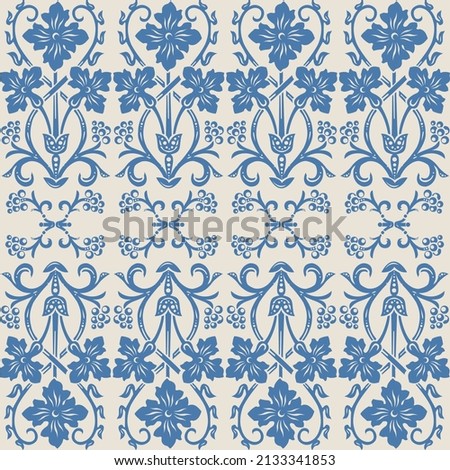 Seamless pattern in ivory ang blue, vintage Victorian floral ornament of wild flowers, scrolls and swirls