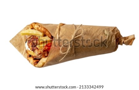 Gyro pita Shawarma sandwich isolated on white, Greek meat food wrap with paper, top view. Design element Royalty-Free Stock Photo #2133342499
