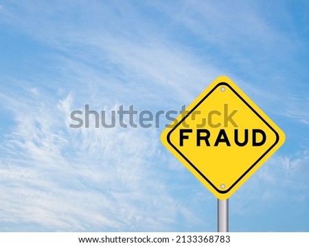 Yellow transportation sign with word fraud on blue color sky background