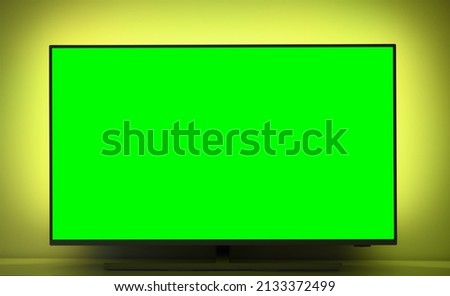 Close up of big green screen led TV in a cozy living room.