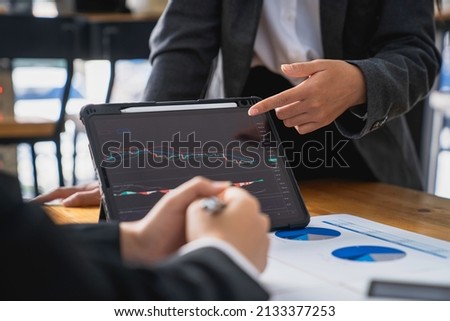 Businessman Working Finance Trading Stock Concept, Investment stock market Entrepreneur Business team discussing and analysis graph stock market trading Royalty-Free Stock Photo #2133377253