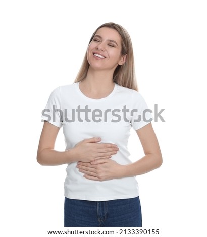 Happy woman touching her belly on white background. Concept of healthy stomach Royalty-Free Stock Photo #2133390155