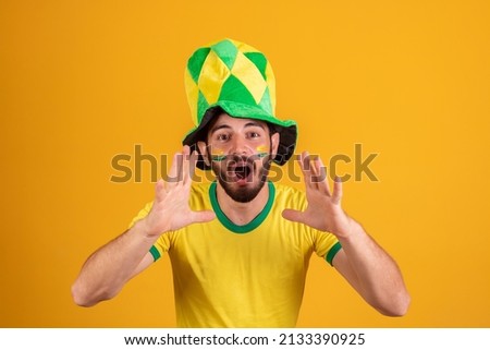 football fanatic. Excited cheering man screaming goal  Royalty-Free Stock Photo #2133390925