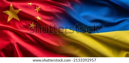 Waving flag concept of Ukraine and China symbolising political connection. Royalty-Free Stock Photo #2133392957