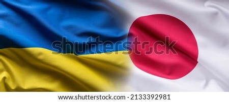 Waving flag concept of Ukraine and Japan symbolising political connection.