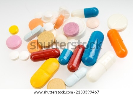Set of different colorful pills and capsules isolated on white background Royalty-Free Stock Photo #2133399467