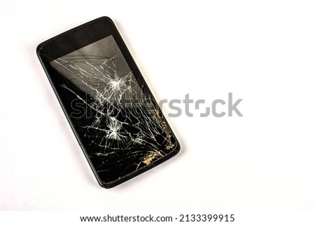Mobile smartphone with broken screen isolated on white.Damaged mobile phone, cracked modern touch screen.Electronics repair service, accident insurance concept.