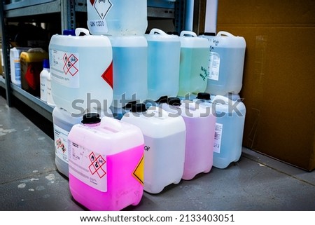 Plastic barrels containing toxic chemicals, waste management concept, industrial background Royalty-Free Stock Photo #2133403051