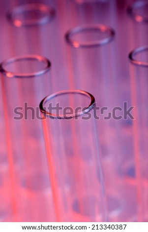 Empty test-tubes with on purple background