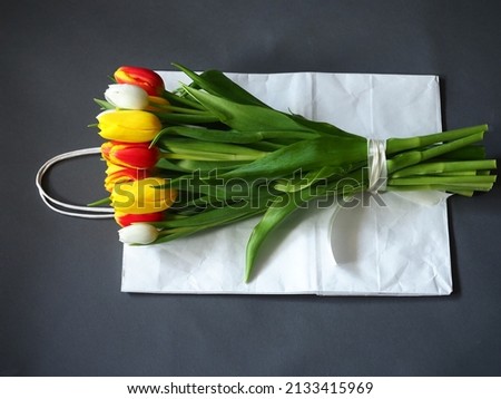 bouquet of tulips on the background of hemp fabric