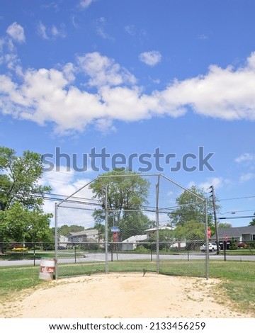 Suburban Neighborhood Baseball field Cage at corner of Bardolier Ln and Aberdeen Rd in West Bay Shore New York on beautiful day