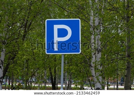 Road sign informing about the parking of cars in the park.