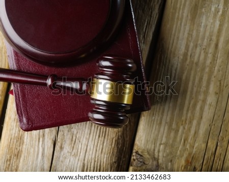 Judge gavel on wooden table and law books in court, law and justice concept with copy space,top view