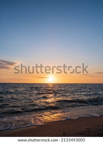 Vertical photo landscape viewpoint for summer sea wind wave cool on holiday calm sea coastal area sunset sky light orange golden evening hours day At Bang san Beach Chonburi Thailand