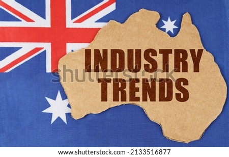 National concept of Australia. On the flag of Australia lies the contour of the map of the country with the inscription - INDUSTRY TRENDS