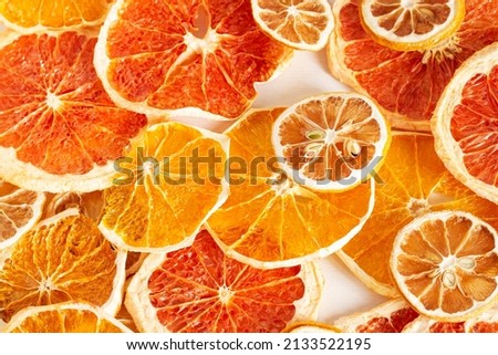Texture of dried sliced ​​citrus fruits. Oranges, lemons, grapefruits