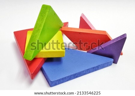Abstract construction from wooden blocks. Colorful wooden building blocks. 