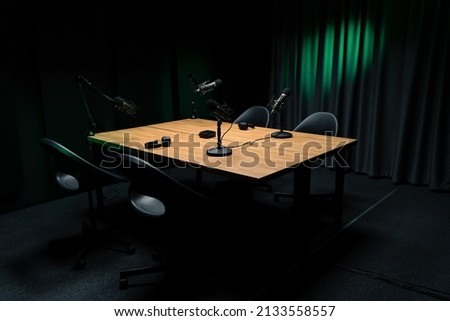 Podcast and blogging concept - workplace with professional equipment microphones and headphones.