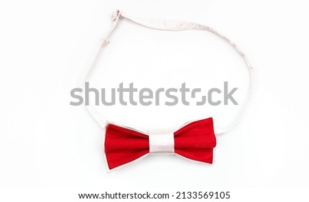 Close up of red bow tie isolated on white background. High quality photo