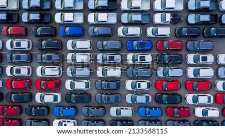 Aerial view new car lined up in the port for import and export business logistic to dealership for sale, Automobile and automotive car parking lot for commercial business industry. Royalty-Free Stock Photo #2133588115