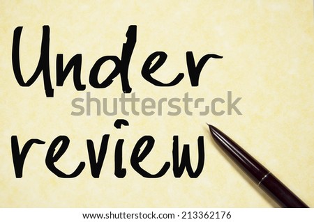 under review text write on paper 