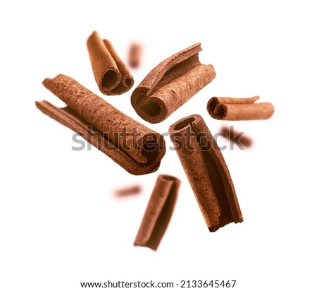 Cinnamon sticks levitate on a white background Royalty-Free Stock Photo #2133645467