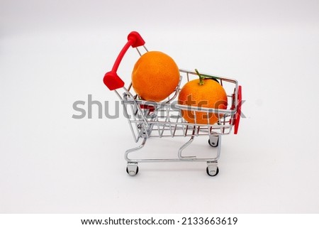 Sicilian oranges and tangerines in metal basket on white background