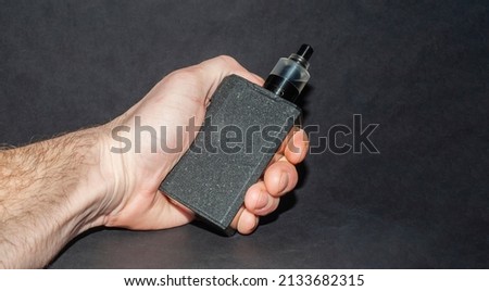 big electronic cigarettes isolated on black background