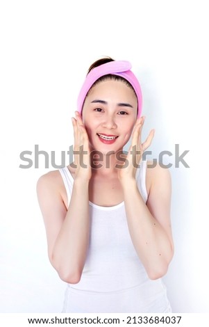 asian woman cleansing face and treatment skin with on white isolated background
