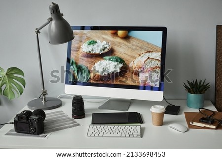 Background image of photographers workplace with computer screen for photo editing, copy space
