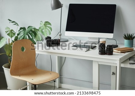 Background image of minimal photographers workplace with computer set up for photo editing