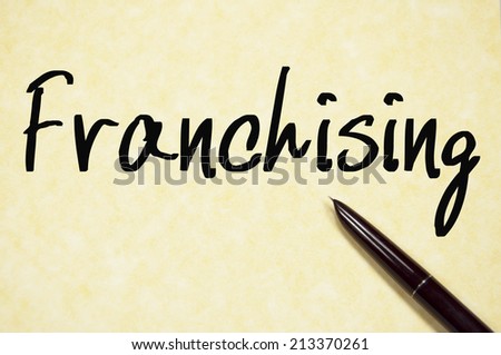 franchising word write on paper 
