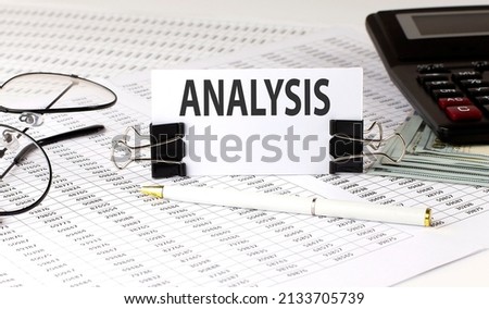 Word writing text ANALYSIS on white sticker on chart background. Business
